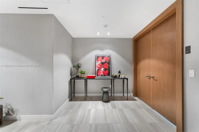 a kitchen with kitchen island granite countertop a sink stove and wooden cabinets