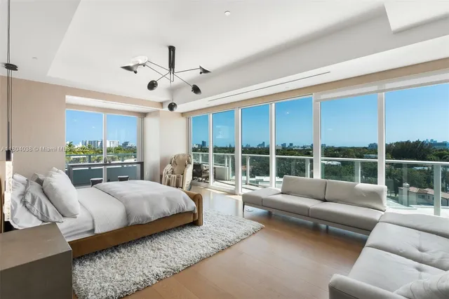 a view of a livingroom with furniture and a window