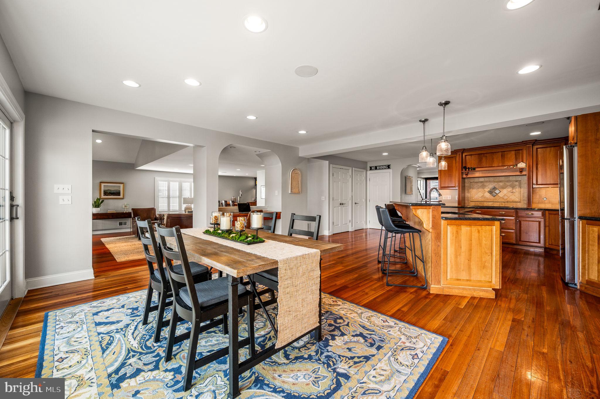 342 Old State Road Berwyn, PA 19312 - Photo 13 of 58 a view of a dining room with furniture wooden floor and a rug