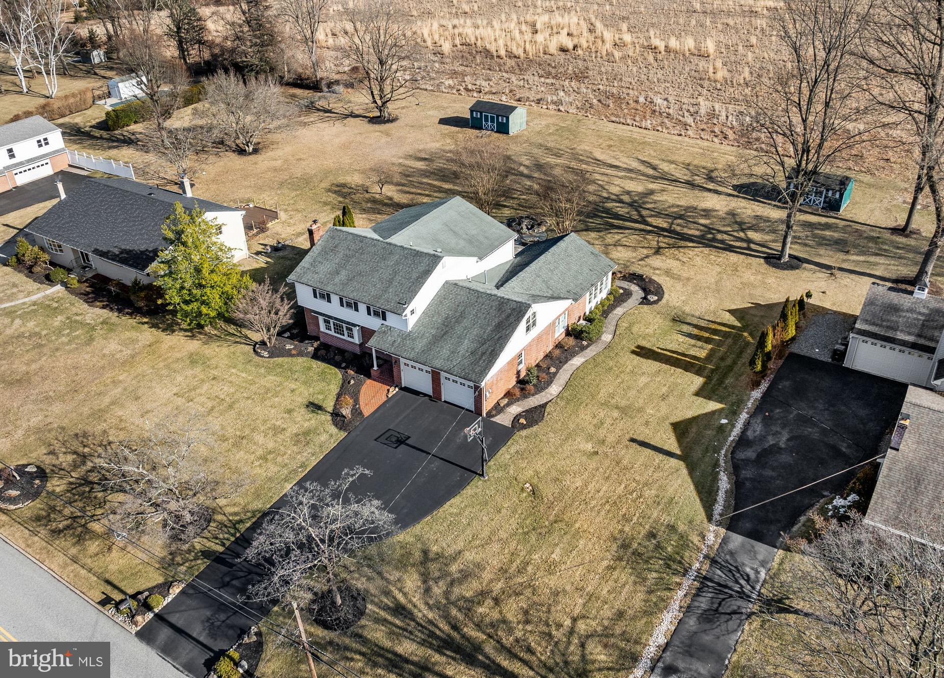 342 Old State Road Berwyn, PA 19312 - Photo 2 of 58 an aerial view of a house with a yard and covered with snow