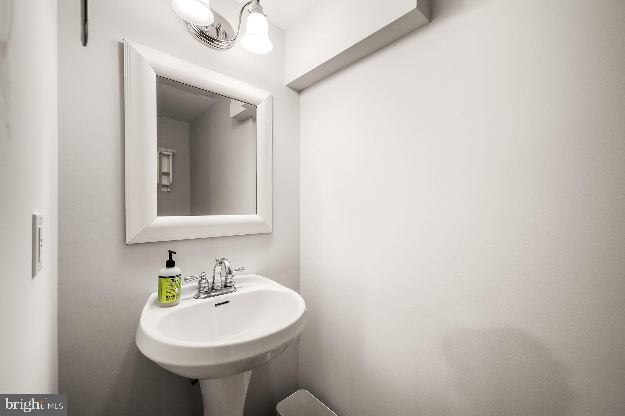 342 Old State Road Berwyn, PA 19312 - Photo 45 of 58 a bathroom with a sink and a mirror