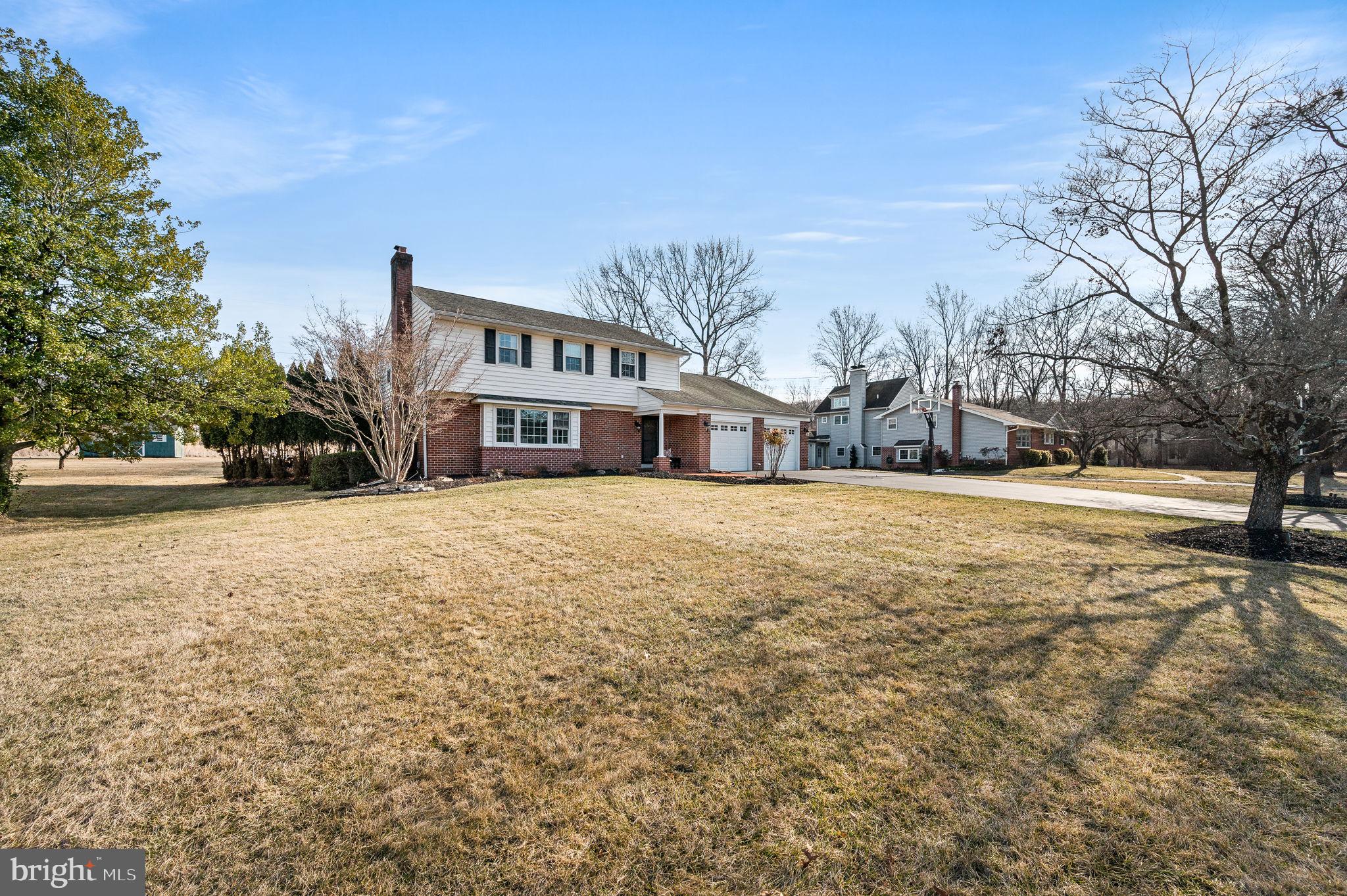 342 Old State Road Berwyn, PA 19312 - Photo 54 of 58 a front view of house with yard and trees around