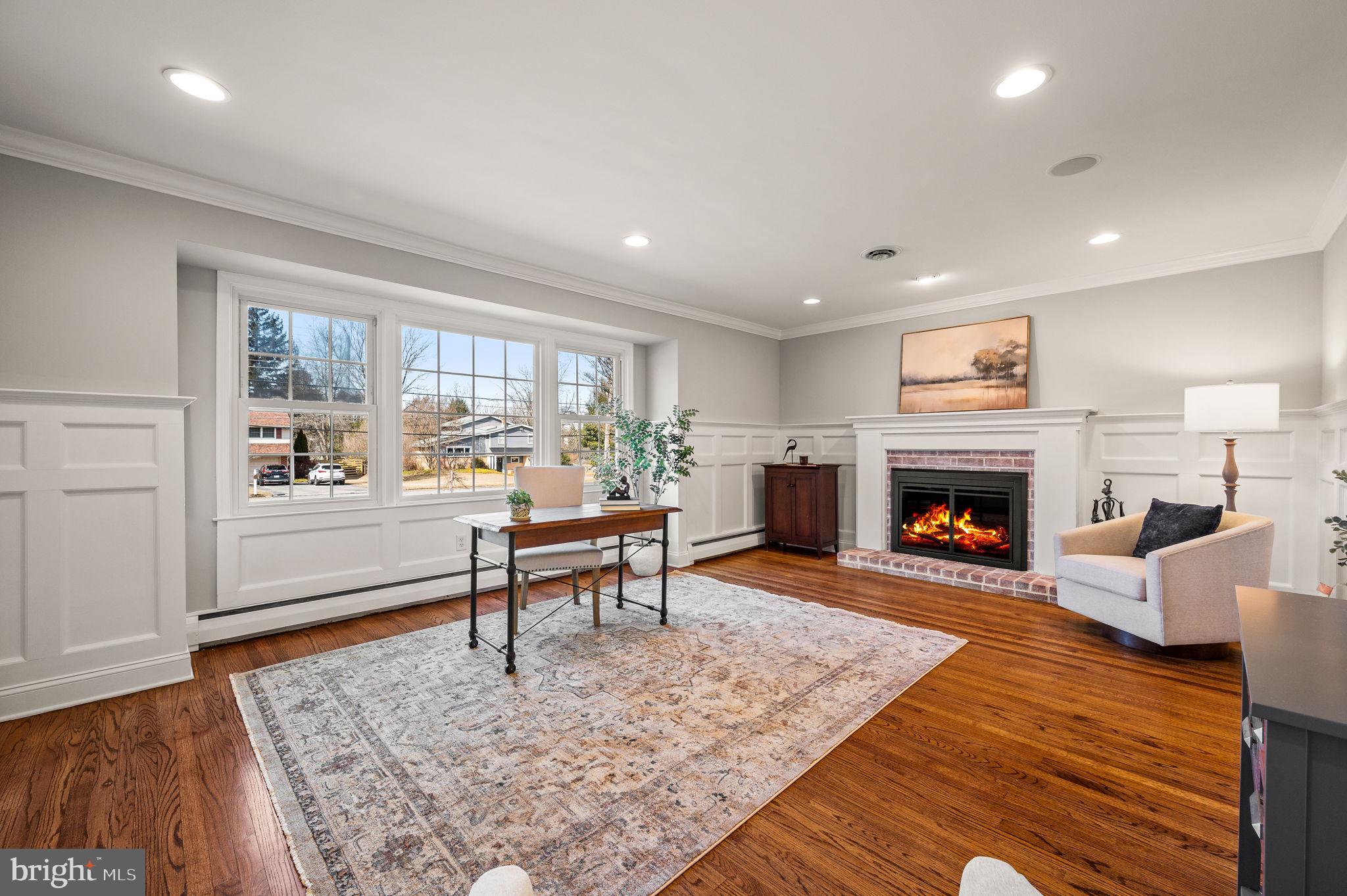 342 Old State Road Berwyn, PA 19312 - Photo 7 of 58 a living room with furniture and a fireplace