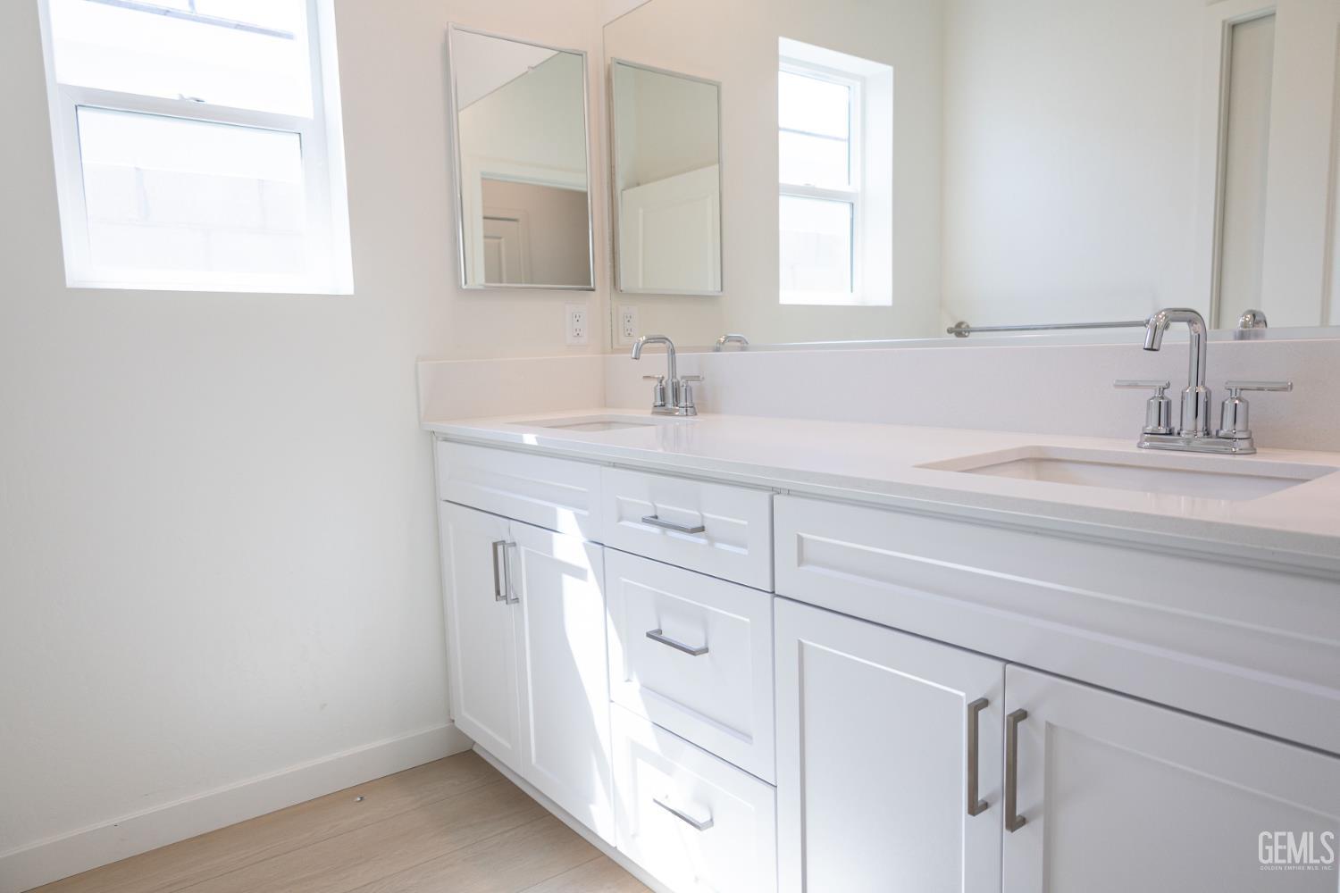 Undisclosed Address Bakersfield, CA 93311 - Photo 14 of 29 a bathroom with a sink and a mirror