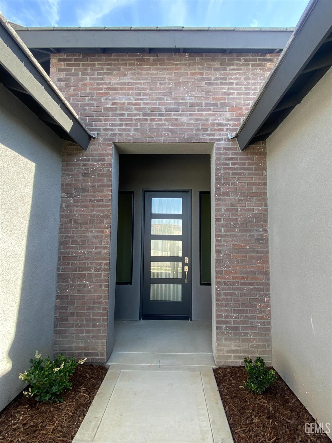 Undisclosed Address Bakersfield, CA 93311 - Photo 3 of 29 a front view of a house with a garage