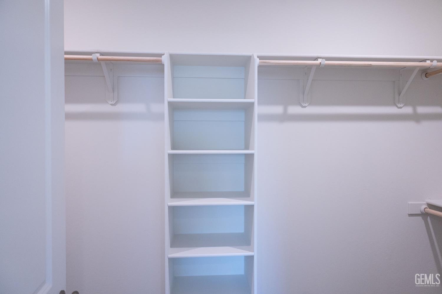 Undisclosed Address Bakersfield, CA 93311 - Photo 10 of 29 a view of an empty walk in closet