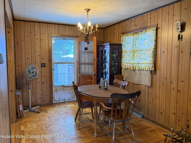 a kitchen with a refrigerator sink and cabinets