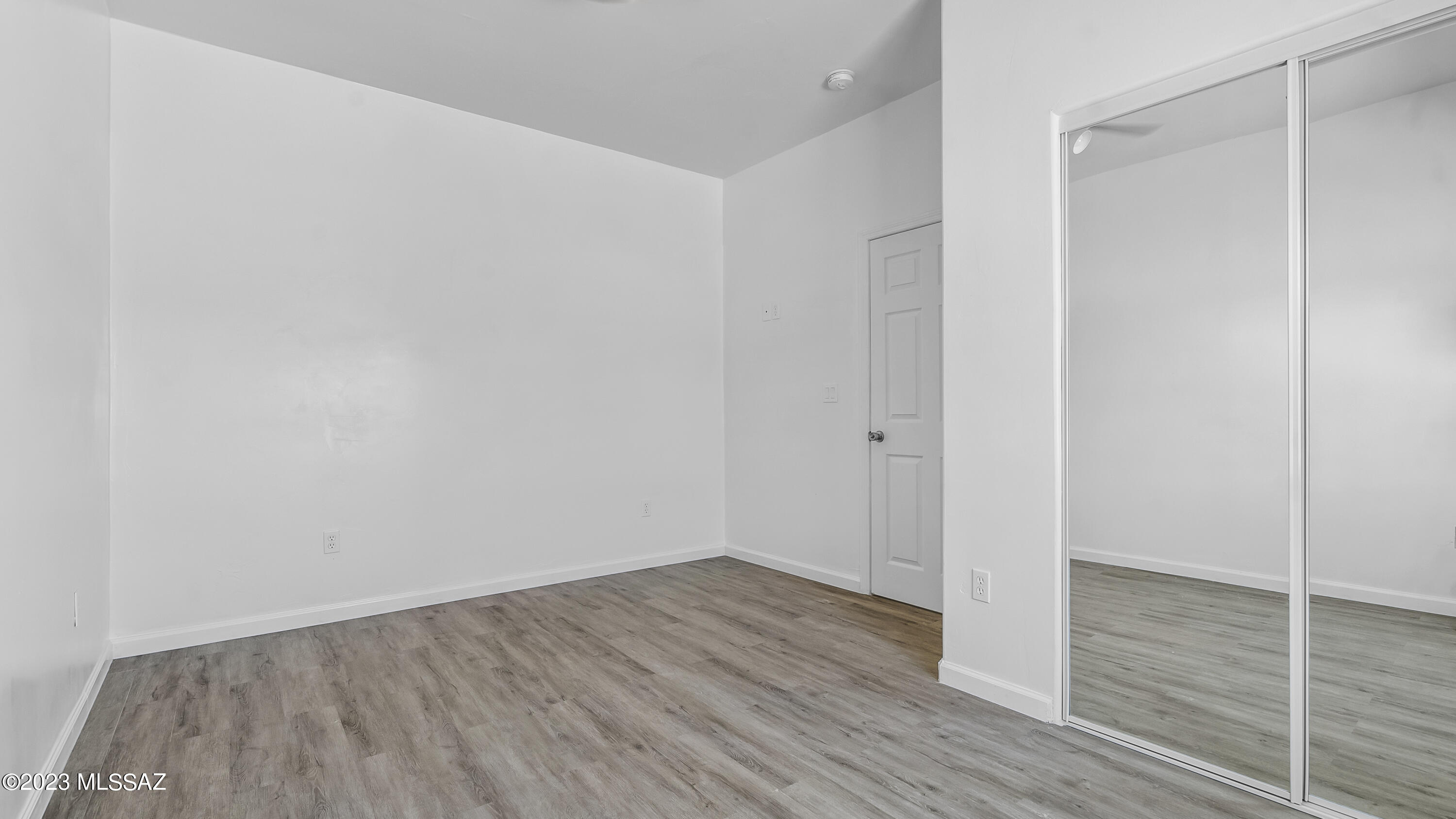 1846 Via Fontana Rio Rico, AZ 85648 - Photo 27 of 30 a view of an empty room with wooden floor