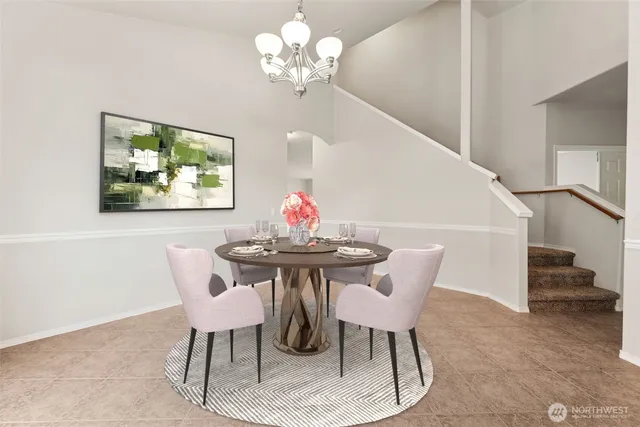 a dining room with furniture and window