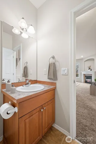 a living room with furniture a window and a fireplace