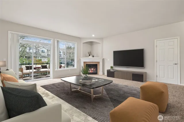 a kitchen with stainless steel appliances kitchen island granite countertop a refrigerator a stove a sink dishwasher and white cabinets with wooden floor