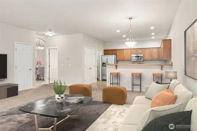a kitchen with stainless steel appliances white cabinets and a stove top oven