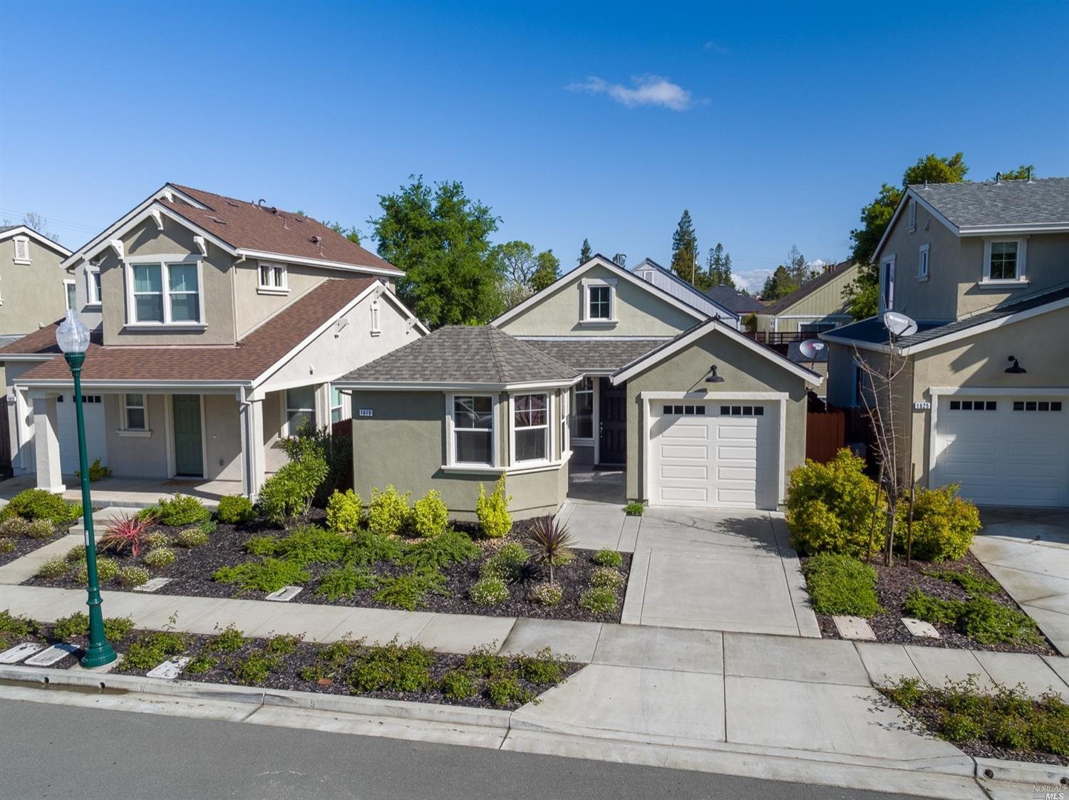 1619 Wishing Well Way Santa Rosa, CA 95403 - Photo 1 of 1 a front view of a house with a yard and garage