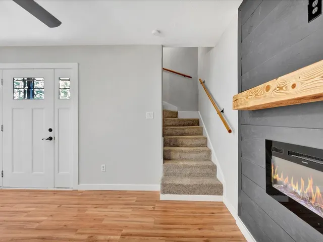 a view of an entryway with wooden floor