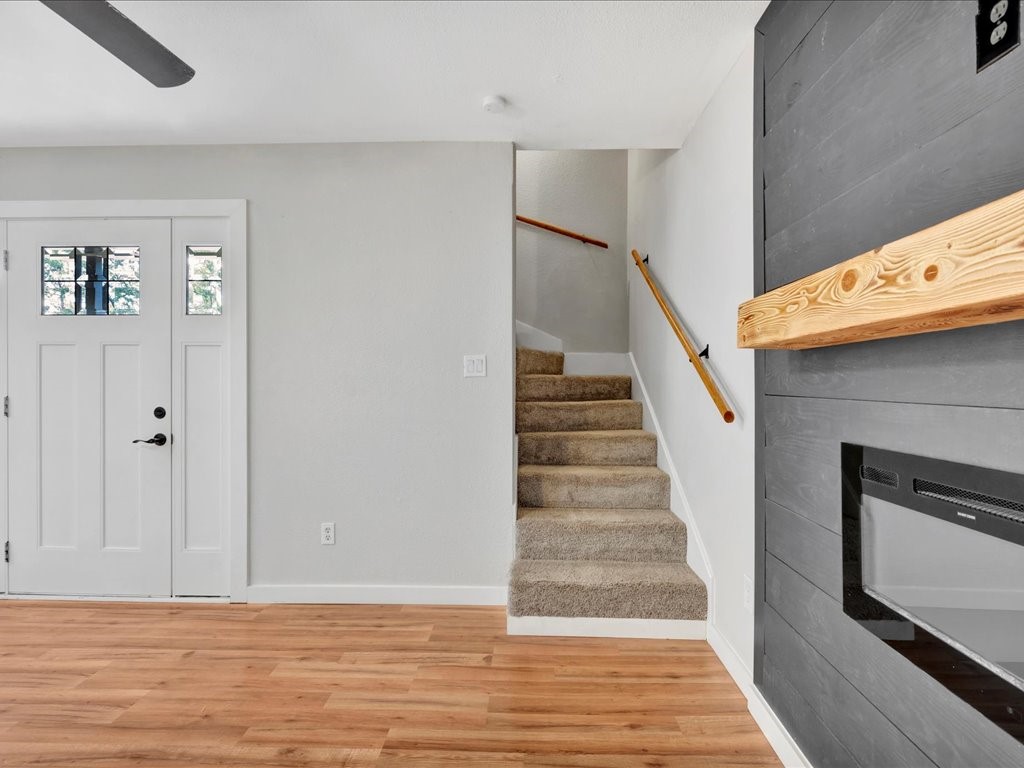 41 Harbour Row Drive Coldspring, TX 77331 - Photo 23 of 36 a view of a livingroom with wooden floor and stairs