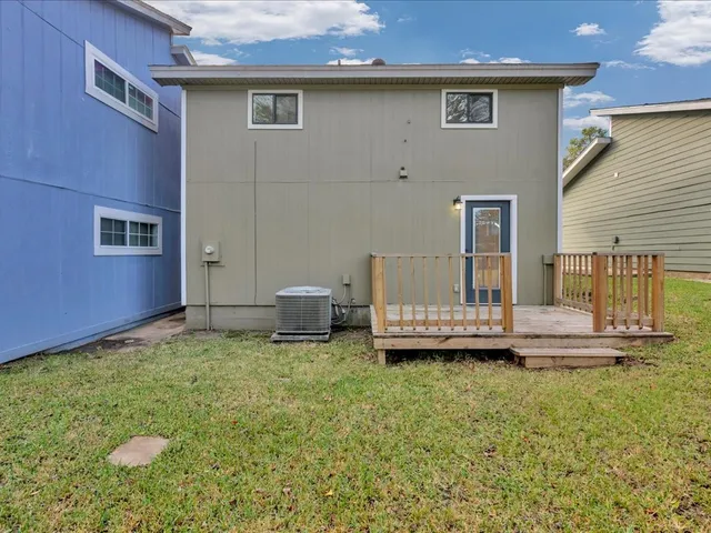 a backyard of a house with table and chairs