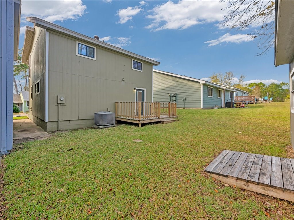 41 Harbour Row Drive Coldspring, TX 77331 - Photo 33 of 36 a view of a house with backyard and garden