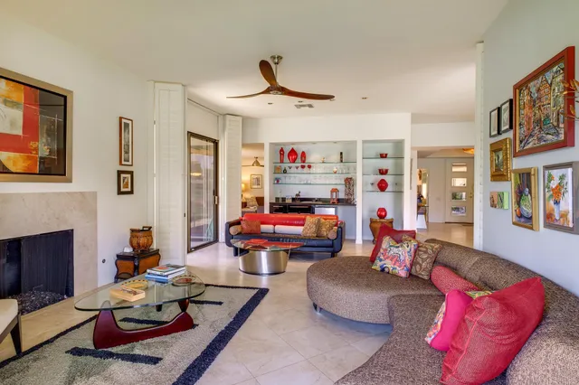 a kitchen with stainless steel appliances granite countertop a stove and a dining table