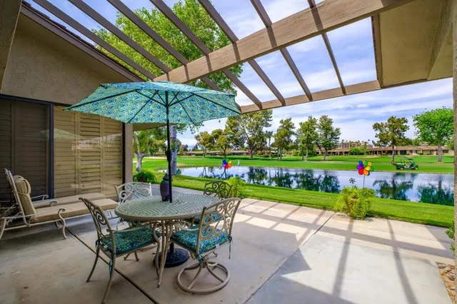 a view of yard with seating area and furniture