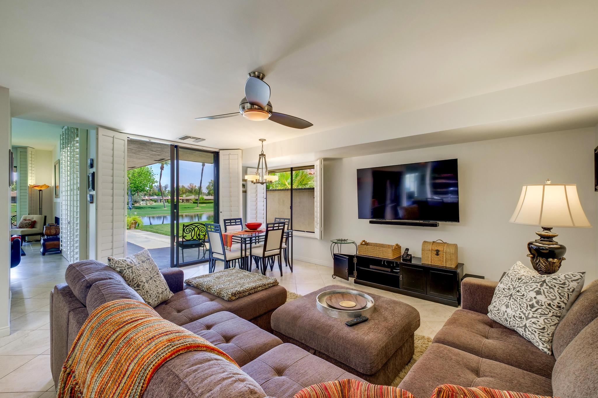 30 Columbia Drive Rancho Mirage, CA 92270 - Photo 25 of 49 a living room with furniture and a flat screen tv