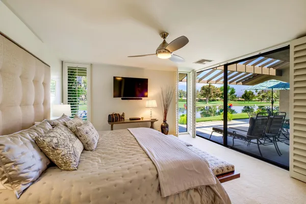 a view of a swimming pool with a lounge chairs