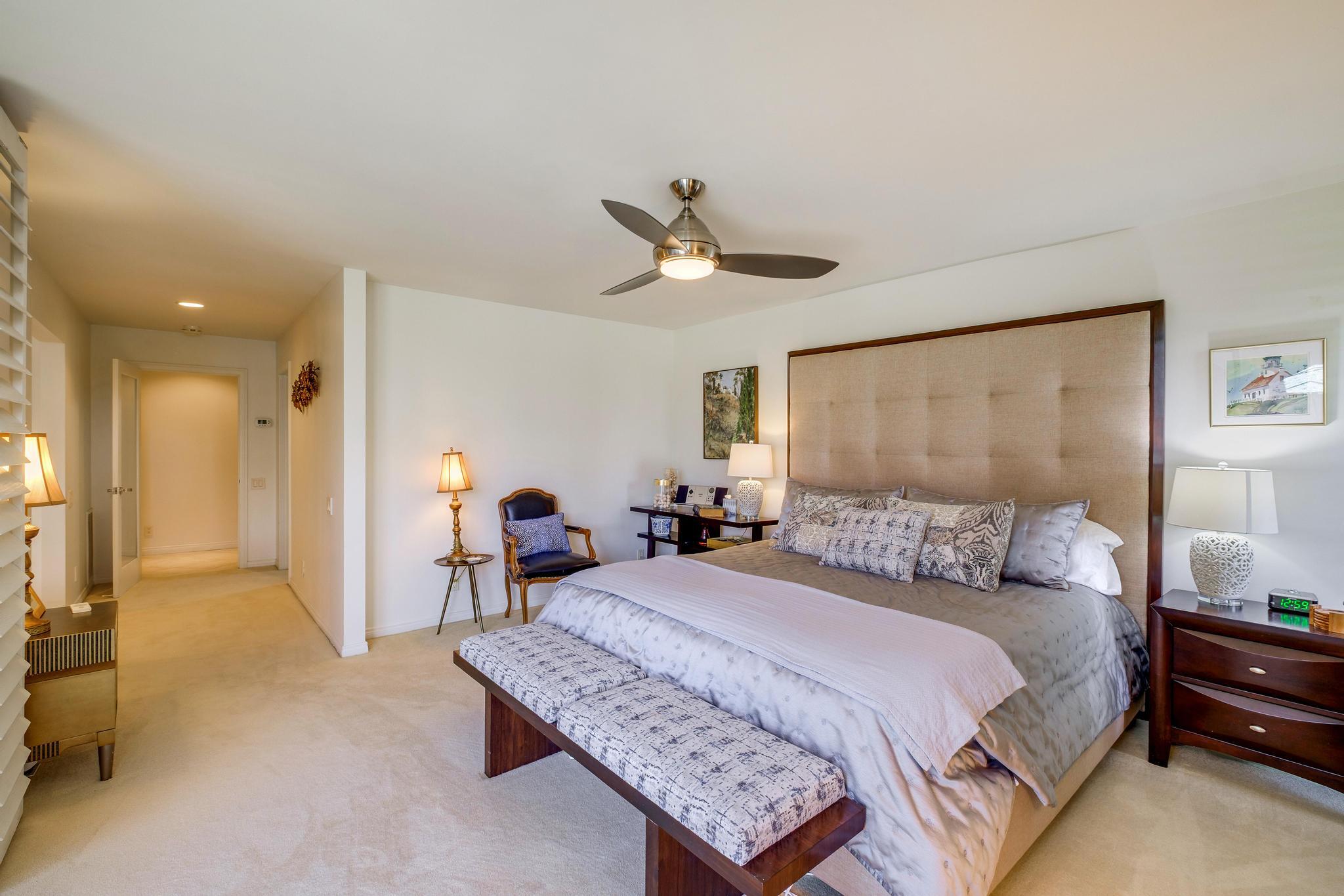 30 Columbia Drive Rancho Mirage, CA 92270 - Photo 32 of 49 a bedroom with a bed and a chandelier