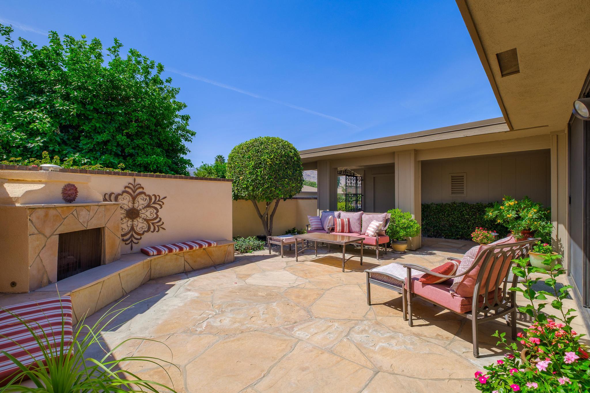 30 Columbia Drive Rancho Mirage, CA 92270 - Photo 6 of 49 a building outdoor space with patio furniture and potted plants