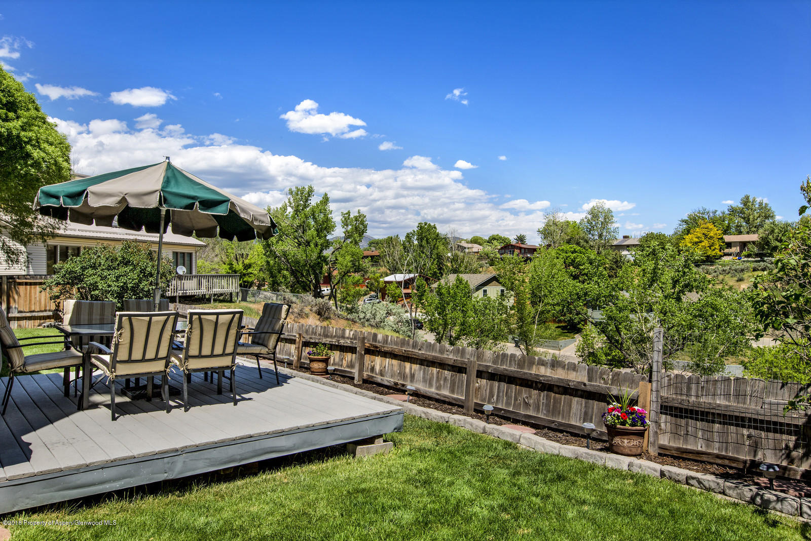 654 Mesa Avenue Rifle, CO 81650 - Photo 8 of 20 a view of a chair and tables in the backyard
