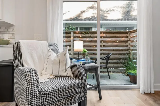 a bedroom with furniture and a window