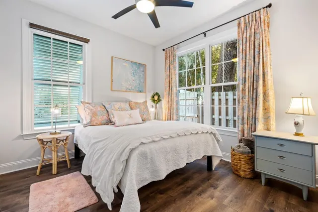 a bedroom with a large bed and a window