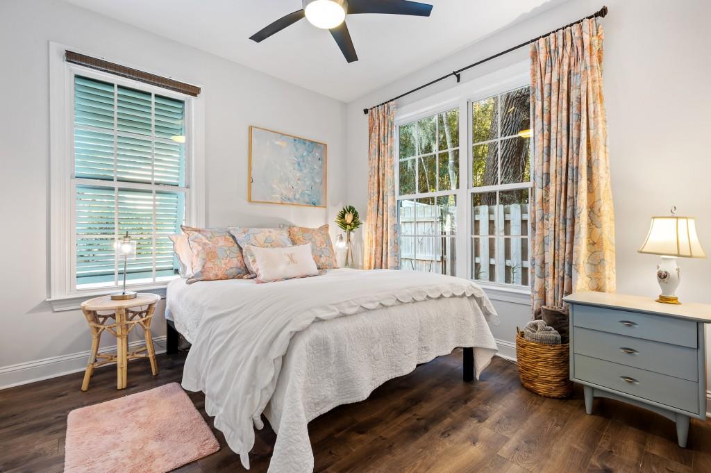 423 Palmetto Street St. Simons, GA 31522 - Photo 19 of 38 a bedroom with a large bed and a window