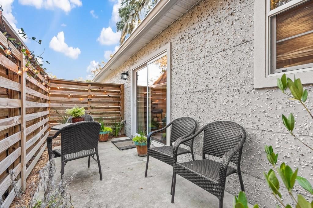 423 Palmetto Street St. Simons, GA 31522 - Photo 24 of 38 a view of a chairs and table in the balcony
