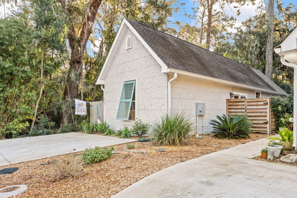 423 Palmetto Street St. Simons, GA 31522 - Photo 26 of 38 a view of a front of house with a yard