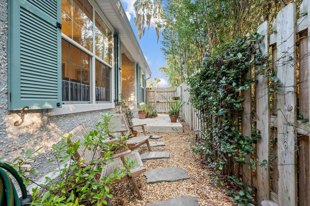 423 Palmetto Street St. Simons, GA 31522 - Photo 5 of 38 a view of house with yard and sitting area