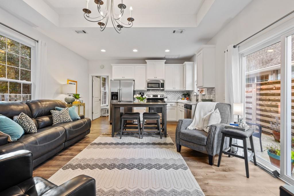 423 Palmetto Street St. Simons, GA 31522 - Photo 7 of 38 a living room with furniture and a large window