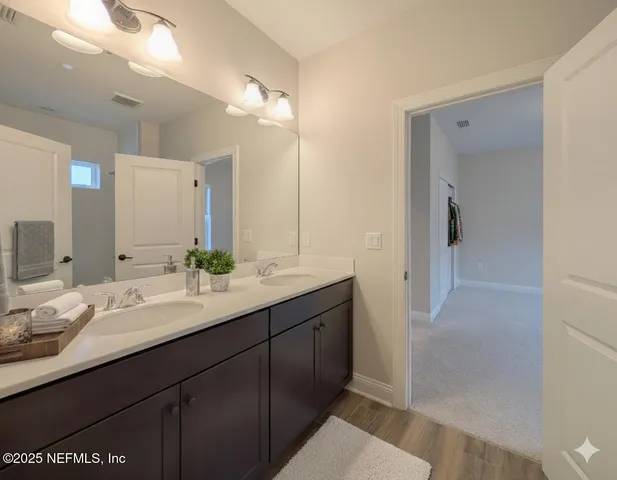 a view of a white house with a yard