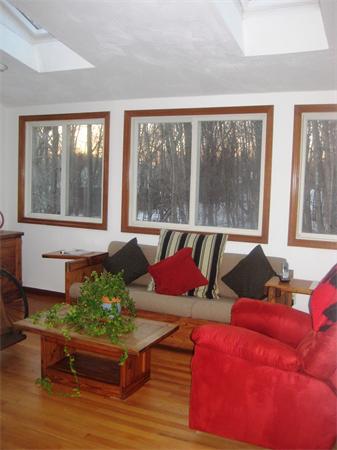149 Hampton Road Sharon, MA 02067 - Photo 4 of 15 a living room filled with furniture and a large window