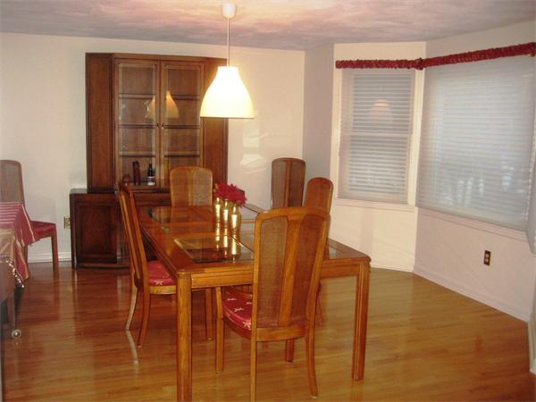 149 Hampton Road Sharon, MA 02067 - Photo 7 of 15 a view of a dining room with furniture and wooden floor