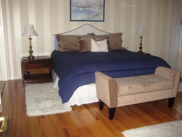 149 Hampton Road Sharon, MA 02067 - Photo 8 of 15 a view of a bedroom with furniture and wooden floor