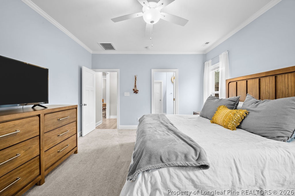 405 Turriff Way Cameron, NC 28326 - Photo 11 of 43 a bedroom with a bed and a flat screen tv