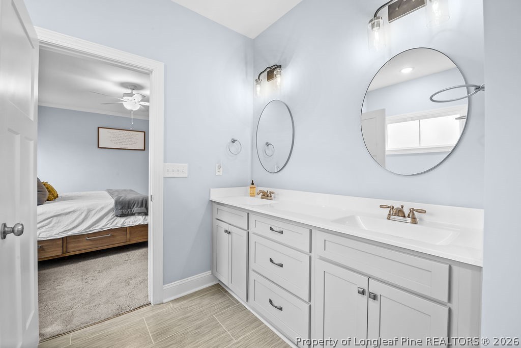 405 Turriff Way Cameron, NC 28326 - Photo 13 of 43 a en suite bathroom with double vanity sinks and a mirror