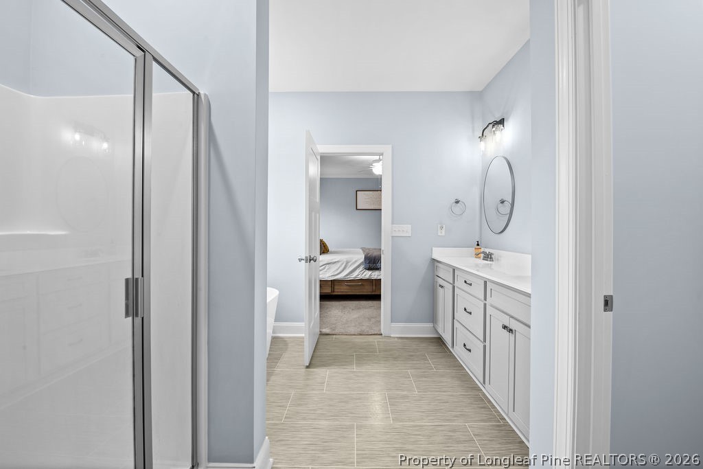 405 Turriff Way Cameron, NC 28326 - Photo 14 of 43 a en suite bathroom with a double vanity sink and a mirror