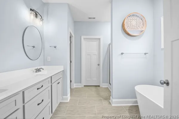 a view of bathroom with dual sinks