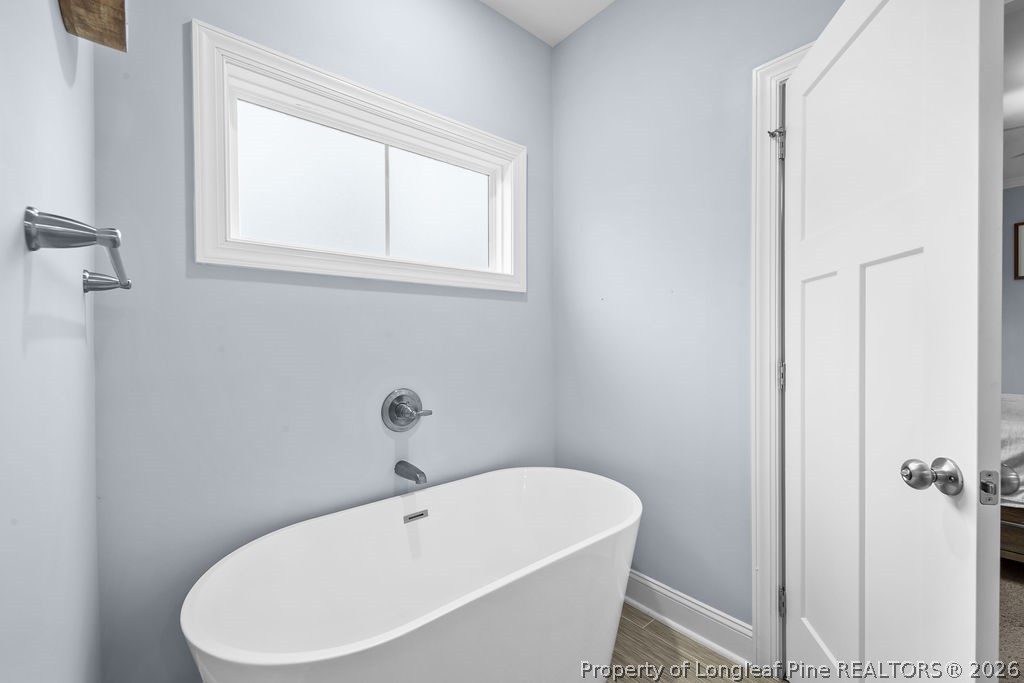 405 Turriff Way Cameron, NC 28326 - Photo 16 of 43 a white bath tub sitting next to a white sink