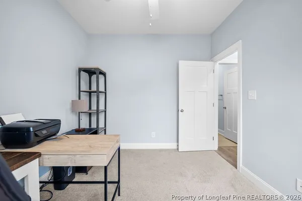 a workspace with furniture and window