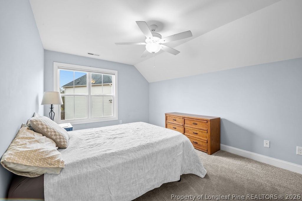 405 Turriff Way Cameron, NC 28326 - Photo 22 of 43 a bedroom with a bed and a window