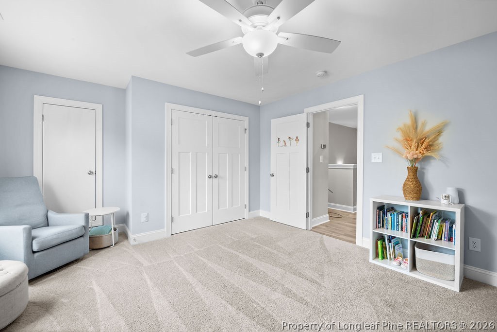 405 Turriff Way Cameron, NC 28326 - Photo 26 of 43 a spacious bedroom with a bed and a chandelier