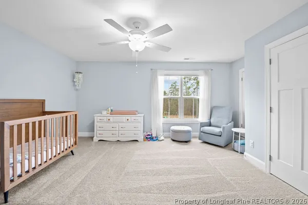 a bedroom with furniture and white walls