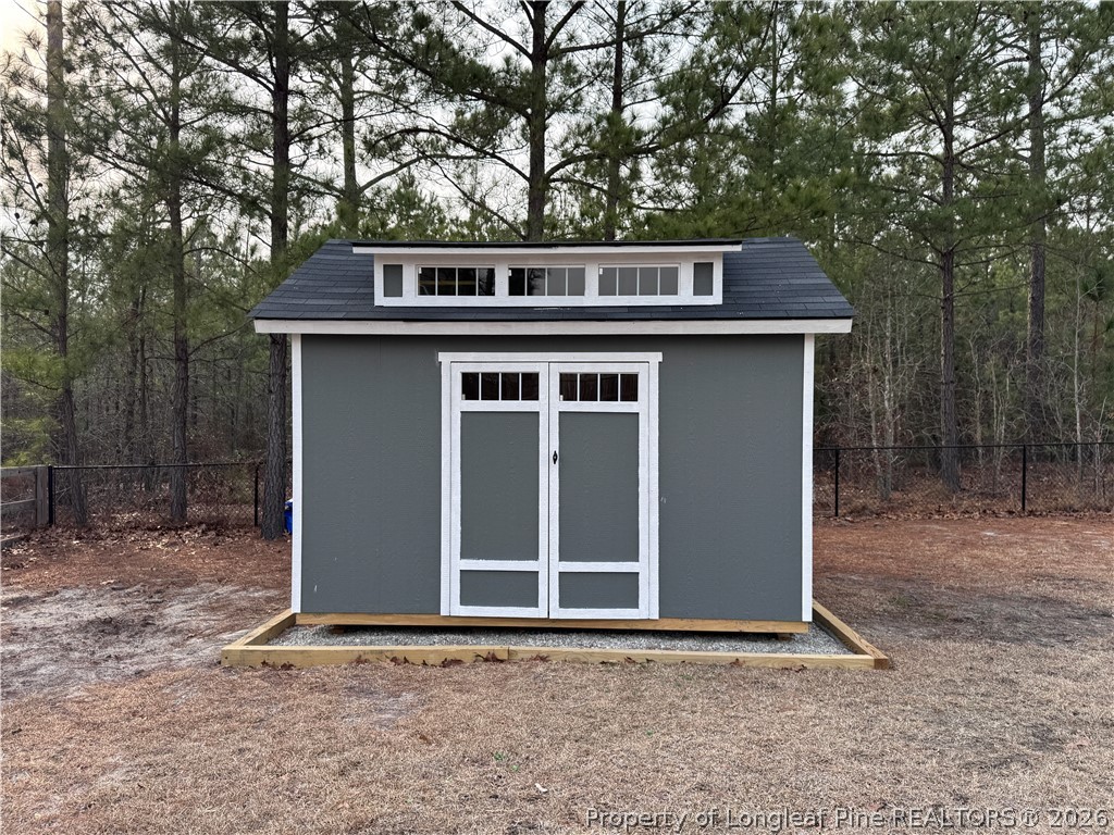 405 Turriff Way Cameron, NC 28326 - Photo 34 of 43 a house with trees in front of it