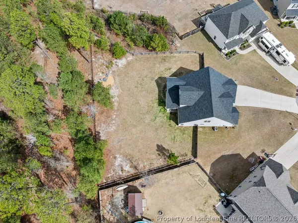 an aerial view of houses with outdoor space